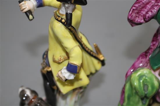 A 19th century Meissen figure of a huntsman and a 19th century English porcelain monkey band figure, 13.5cm and 16cm